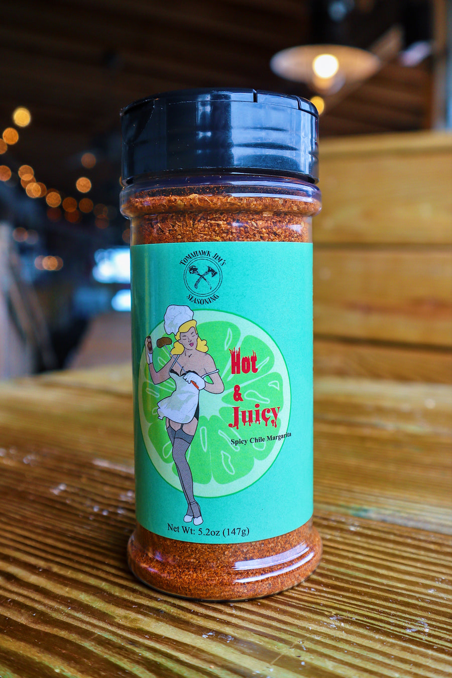 Spice jar with a colorful label on a wooden surface