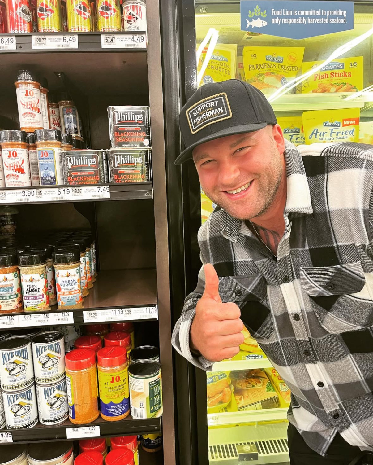 Tomahawk Jim standing with spices at Food Lion grocery store